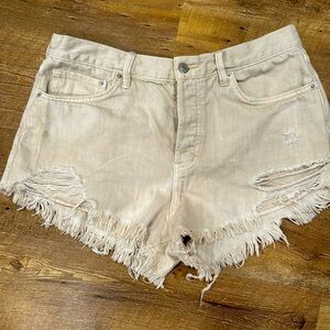 We the Free tan denim cut off shorts. Size 31